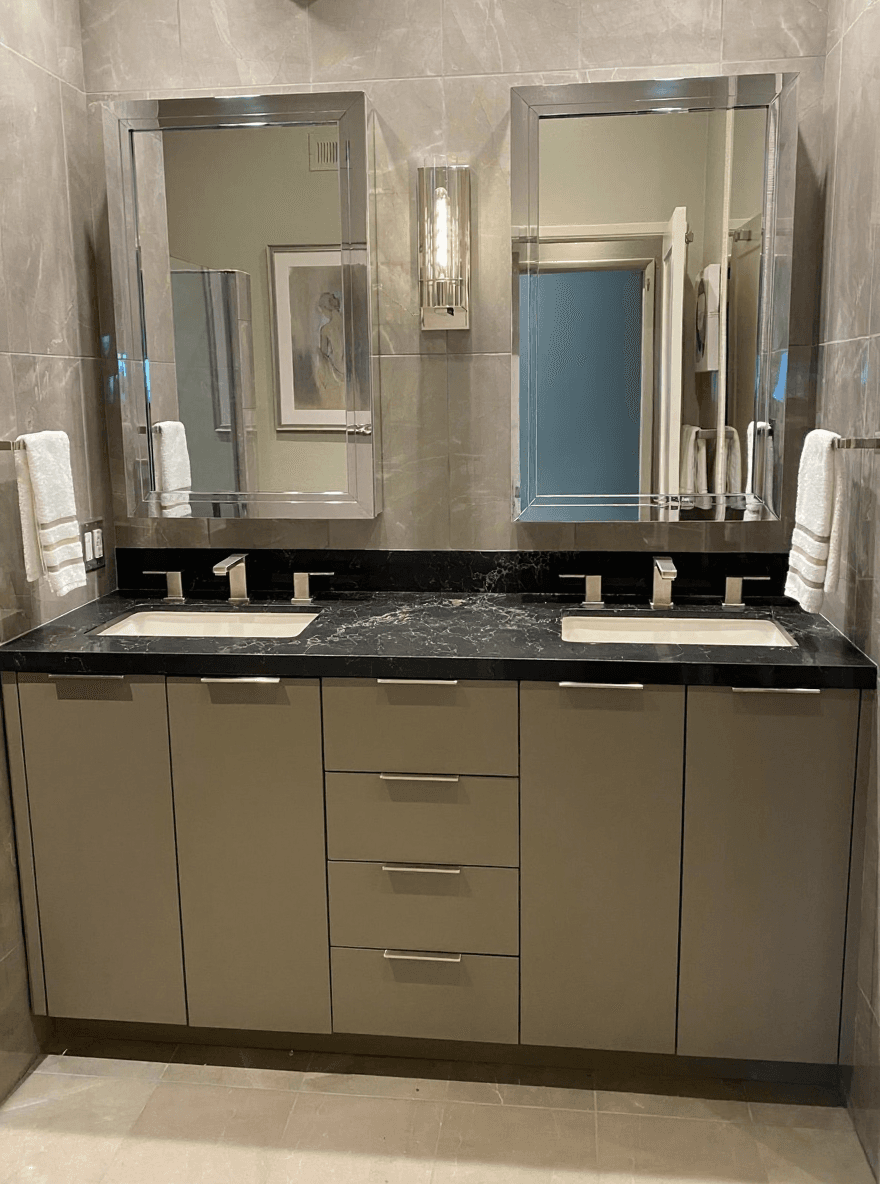 Black-marble double vanity with chrome fixtures