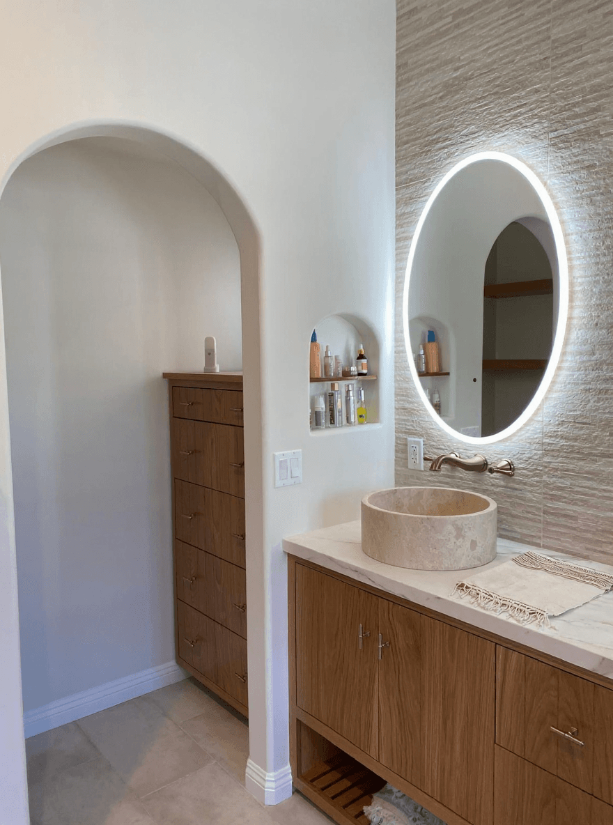Arched alcove with travertine vessel sink