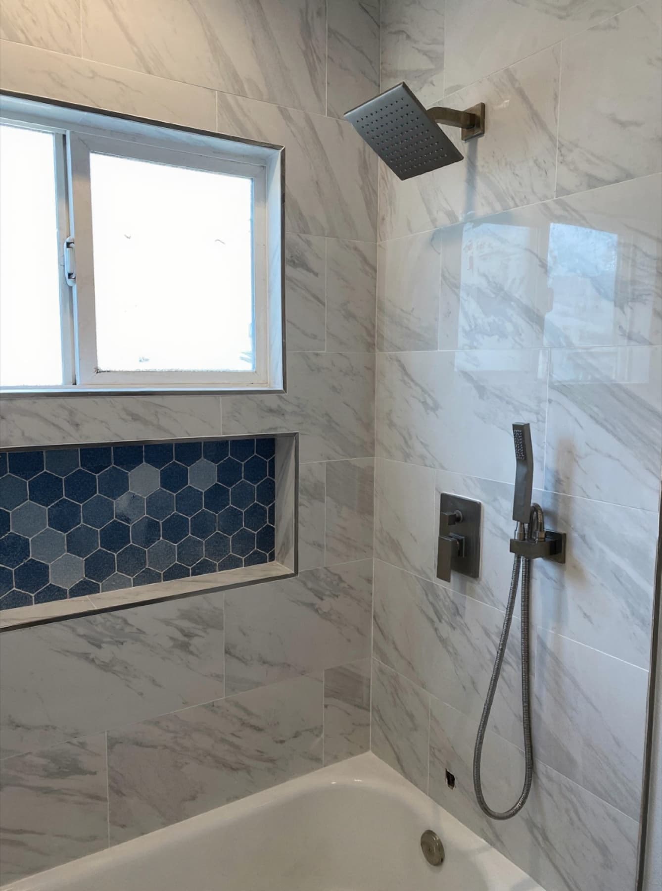 Marble shower with brushed-nickel rainfall