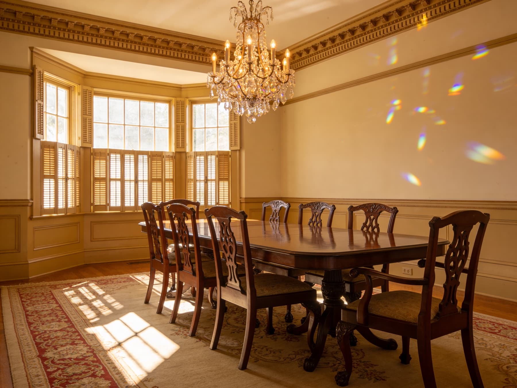 Restored Victorian dining room with crystal chandelier